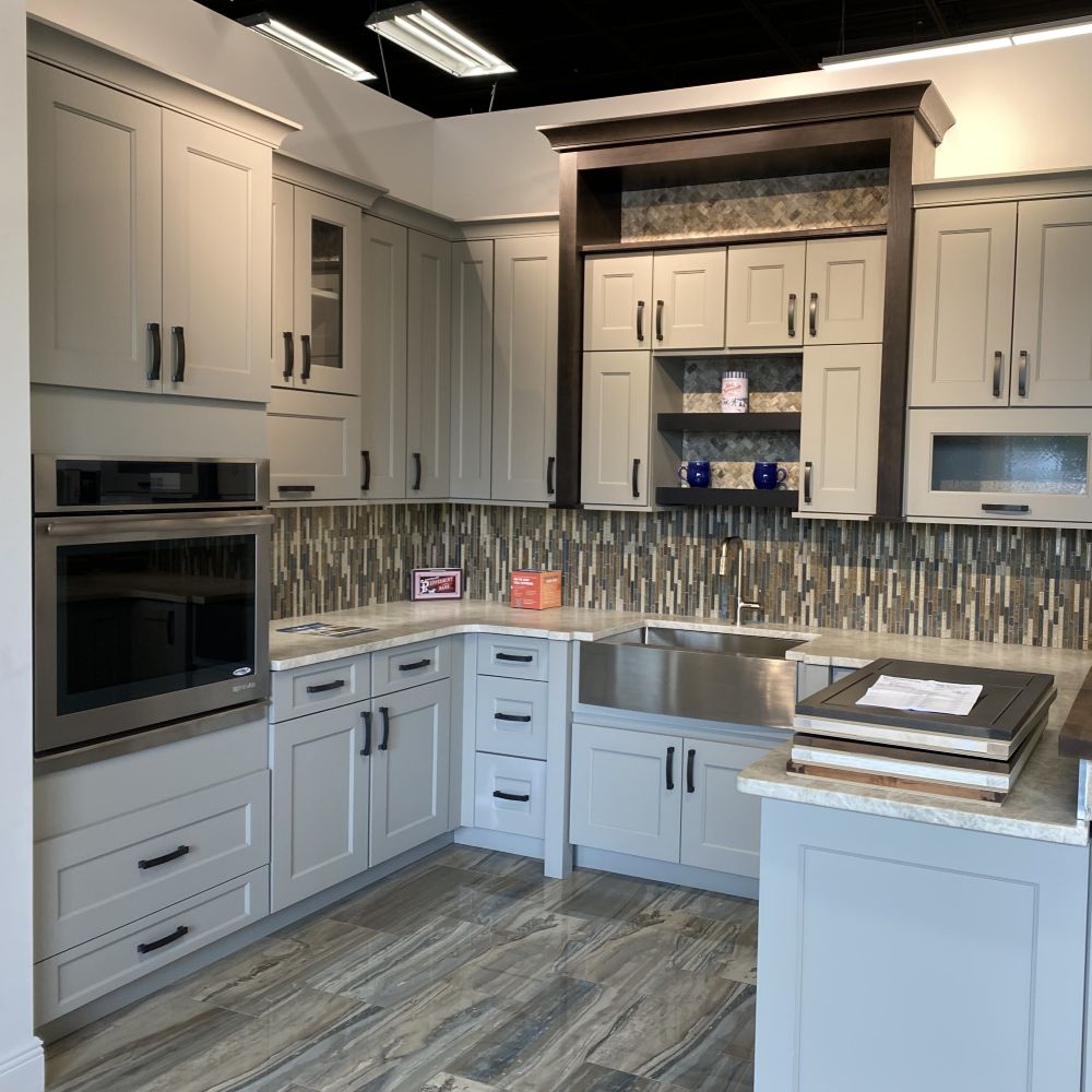 modern kitchen with green cabinetry