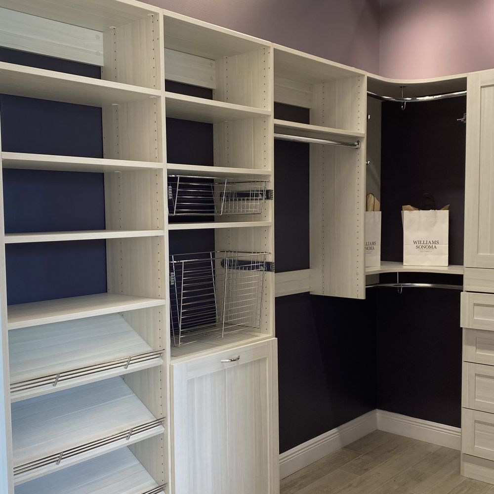 laundry room with blue built-in cabinetry and a sink